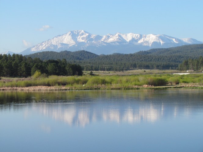 Manitou Lake with view of North Face of Pikes Peak. Teller County, Colorado. The snow has not been gone long at this elevation.